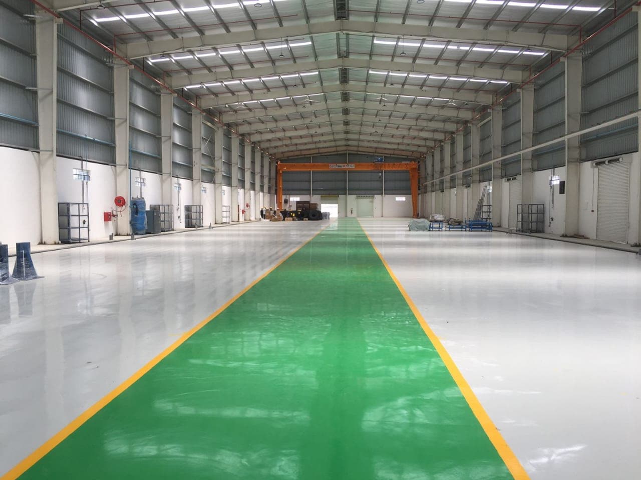 Epoxy flooring with safety walkway in a production hall